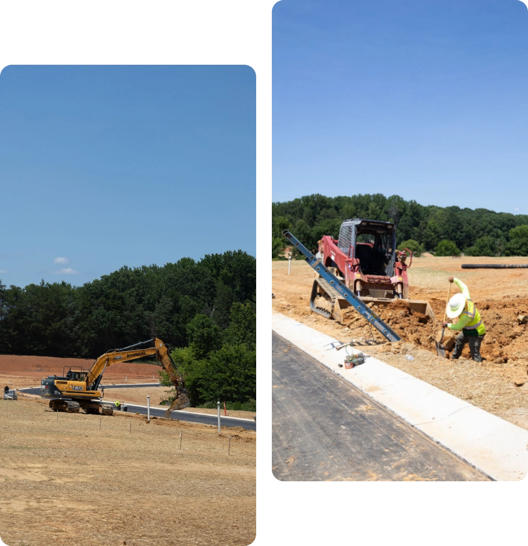 Workers constructing a sidewalk beside a road with heavy machinery.